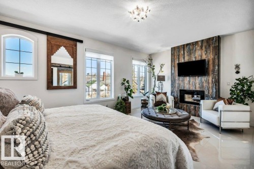 10920 96 Street, Edmonton, AB - Indoor Photo Showing Bedroom With Fireplace