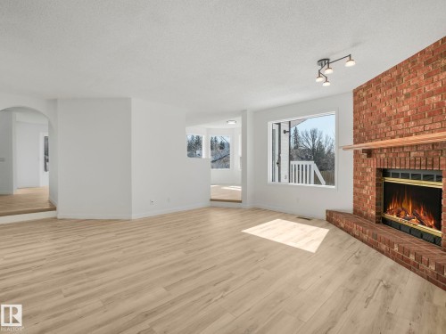 4103 28 Avenue, Edmonton, AB - Indoor Photo Showing Living Room With Fireplace
