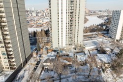Urban landscape featuring high-rise architecture and a riverfront setting - 