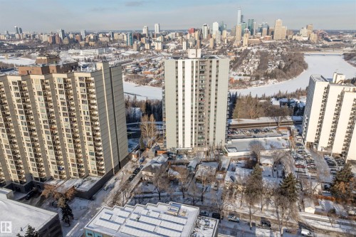Mid-rise residential building featuring multiple balconies, a structured facade, and surrounding surface parking - 10124 88 Avenue, Edmonton, AB - Outdoor With View