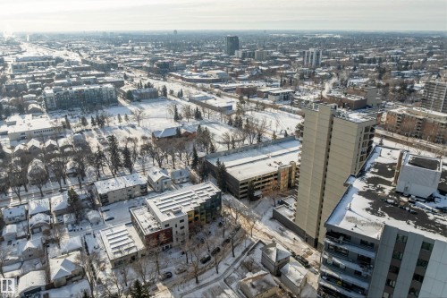 Expansive aerial perspective showcasing a dense urban environment with a mix of residential and commercial buildings - 10124 88 Avenue, Edmonton, AB - Outdoor With View