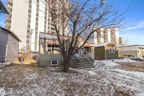 Single-family residence with exterior stairs and metal railings - 10124 88 Avenue, Edmonton, AB - Outdoor