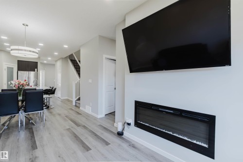 Open-concept living area with a built-in linear electric fireplace - 343 Edgemont Drive, Edmonton, AB - Indoor With Fireplace