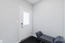 Entryway featuring a white door with an integrated frosted glass panel and contemporary digital lock - 343 Edgemont Drive, Edmonton, AB  - Indoor Photo Showing Other Room 