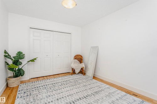 Room with light wood-finish flooring and white walls - 17820 57 Avenue, Edmonton, AB - Indoor Photo Showing Other Room