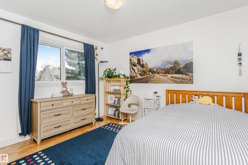 Hardwood-style flooring throughout - 17820 57 Avenue, Edmonton, AB - Indoor Photo Showing Bedroom