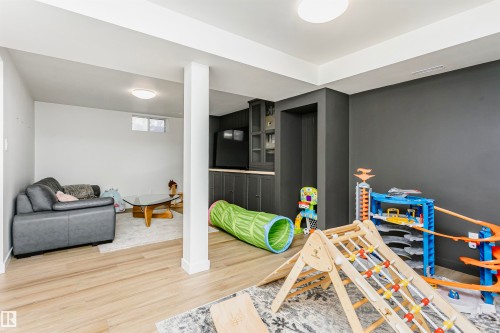 Finished lower level featuring light wood-finish flooring - 17820 57 Avenue, Edmonton, AB - Indoor