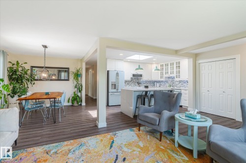 Open-concept living space featuring wood-finish flooring throughout - 10339 36A Avenue, Edmonton, AB - Indoor Photo Showing Living Room
