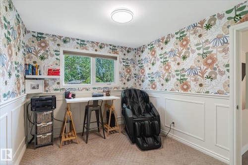 Room featuring decorative floral wallpaper, white wainscoting, and carpet flooring - 10339 36A Avenue, Edmonton, AB - Indoor