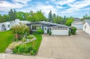 Ranch-style residence featuring a dark gray exterior, white trim, and a prominent front-facing window - 10339 36A Avenue, Edmonton, AB  - Outdoor 