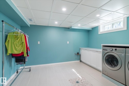 Dedicated laundry area featuring a coffered ceiling, recessed lighting, and a window for natural light - 10339 36A Avenue, Edmonton, AB - Indoor Photo Showing Laundry Room