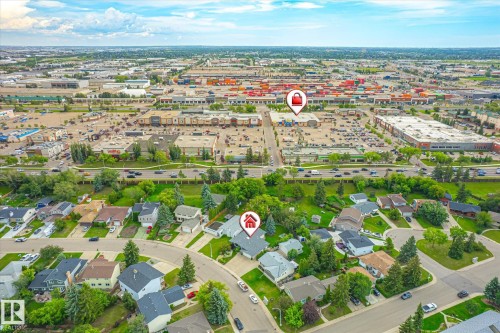 Residential neighborhood with mature trees and a curvilinear street pattern, featuring individual detached homes - 10339 36A Avenue, Edmonton, AB - Outdoor With View