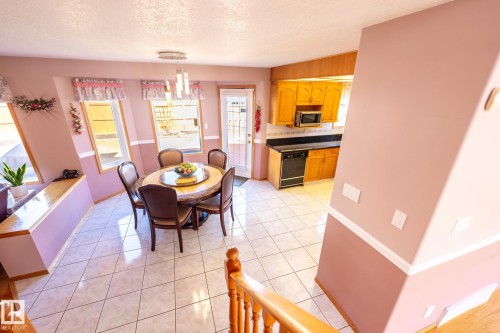 Tiled flooring throughout dining area and kitchen - 5736 161 Avenue, Edmonton, AB - Indoor Photo Showing Other Room