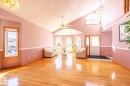Spacious living area featuring high vaulted ceilings and hardwood flooring - 5736 161 Avenue, Edmonton, AB  - Indoor Photo Showing Other Room 