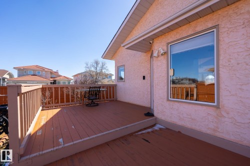 Exterior deck with wood railings and a wood-finish floor - 5736 161 Avenue, Edmonton, AB - Outdoor With Exterior