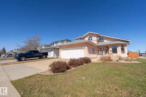Two-story exterior with stucco finish and arched windows - 5736 161 Avenue, Edmonton, AB - Outdoor With Facade