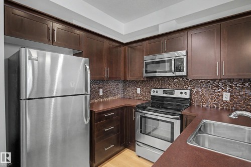 123 2584 Anderson Way, Edmonton, AB - Indoor Photo Showing Kitchen With Stainless Steel Kitchen With Double Sink With Upgraded Kitchen
