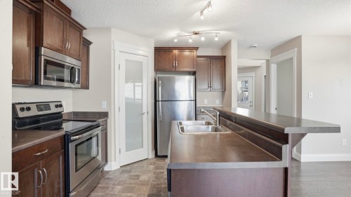 7 Ashby Gardens, Spruce Grove, AB - Indoor Photo Showing Kitchen With Double Sink