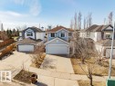 Light blue two-story residence featuring a front-facing garage with a concrete driveway - 7 Doucette Place, St. Albert, AB  - Outdoor 