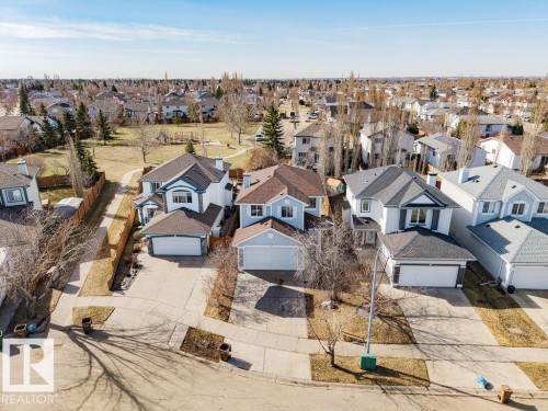 Residential property with light blue siding and a brown shingle roof - 7 Doucette Place, St. Albert, AB - Outdoor With Facade