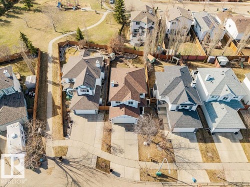 Elevated aerial perspective showcasing multiple residential properties - 7 Doucette Place, St. Albert, AB - 