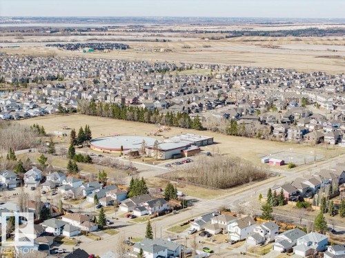 Aerial perspective showcasing a residential development with varied housing styles - 7 Doucette Place, St. Albert, AB - Outdoor With View