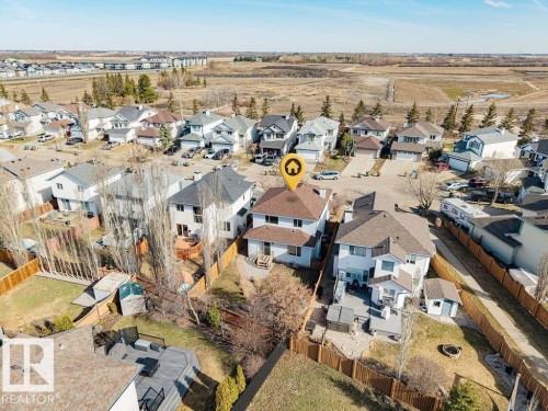 Residential property with a brown shingle roof and light-colored siding - 7 Doucette Place, St. Albert, AB - Outdoor With View