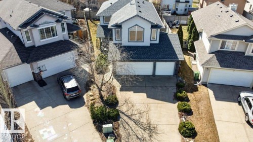 Two-story residence featuring a dual-tone exterior with light gray stucco and dark gray roof shingles - 10 Erickson Close, St. Albert, AB - Outdoor