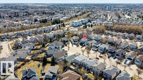Aerial perspective showcasing a residential neighborhood with detached homes, mature trees, and varying architectural styles - 10 Erickson Close, St. Albert, AB - Outdoor With View