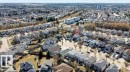 Aerial perspective showcasing a residential neighborhood with detached homes, mature trees, and varying architectural styles - 10 Erickson Close, St. Albert, AB  - Outdoor With View 