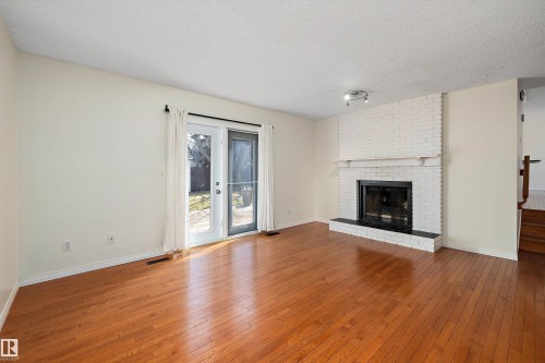 115 Walker Road, Edmonton, AB - Indoor Photo Showing Living Room With Fireplace