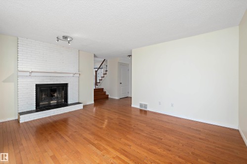 115 Walker Road, Edmonton, AB - Indoor Photo Showing Living Room With Fireplace