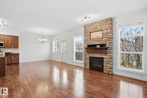 171 Keyport Circle, Leduc, AB - Indoor Photo Showing Other Room With Fireplace