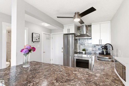 105 10230 120 Street Nw, Edmonton, AB - Indoor Photo Showing Kitchen With Stainless Steel Kitchen With Double Sink With Upgraded Kitchen