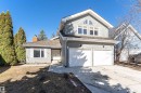 Exterior featuring light gray siding, white trim, an attached two-car garage, and a concrete driveway - 6016 177 Street, Edmonton, AB  - Outdoor 