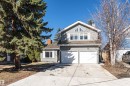 Two-story residence featuring gray siding and shingle accents, a two-car garage, and a concrete driveway - 6016 177 Street, Edmonton, AB  - Outdoor 