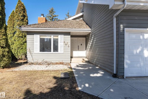 Gray horizontal siding exterior with white double entry doors - 6016 177 Street, Edmonton, AB - Outdoor With Exterior