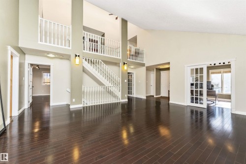 Spacious interior with high ceilings and dark wood-finish flooring - 6016 177 Street, Edmonton, AB - Indoor