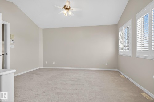 Spacious room with sloped ceilings and light beige carpeting - 34 3003 34 Avenue, Edmonton, AB - Indoor Photo Showing Other Room