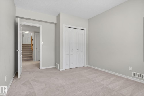 Interior room featuring light-toned carpeting, neutral wall paint, and white trim - 34 3003 34 Avenue, Edmonton, AB - Indoor Photo Showing Other Room