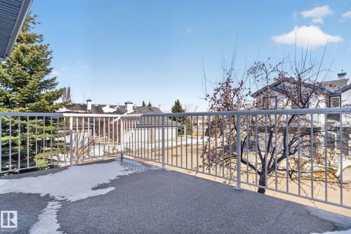 Outdoor balcony featuring a textured concrete surface and white metal railing - 34 3003 34 Avenue, Edmonton, AB - Outdoor With Balcony