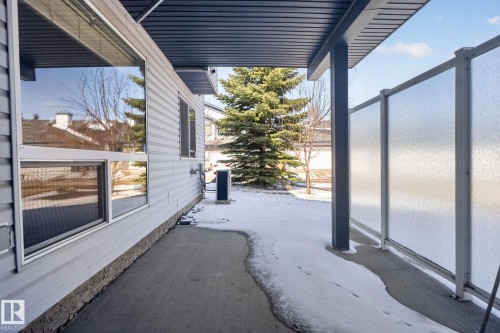 Concrete patio with an overhead cover, privacy screens, and exterior siding - 34 3003 34 Avenue, Edmonton, AB - Outdoor With Balcony With Exterior