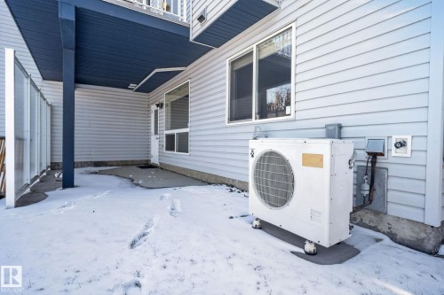 Exterior siding featuring a ground-level patio area under a covered deck - 34 3003 34 Avenue, Edmonton, AB - Outdoor With Exterior