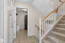 Carpeted staircase with white balusters and a light wood handrail - 34 3003 34 Avenue, Edmonton, AB  - Indoor Photo Showing Other Room 