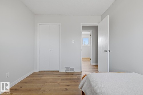 Interior space featuring light gray walls and wood-finish flooring - 17604 85 Avenue, Edmonton, AB - Indoor Photo Showing Bedroom