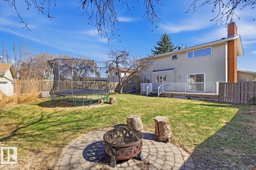 Spacious backyard with a paver patio and fire pit - 17604 85 Avenue, Edmonton, AB - Outdoor With Deck Patio Veranda