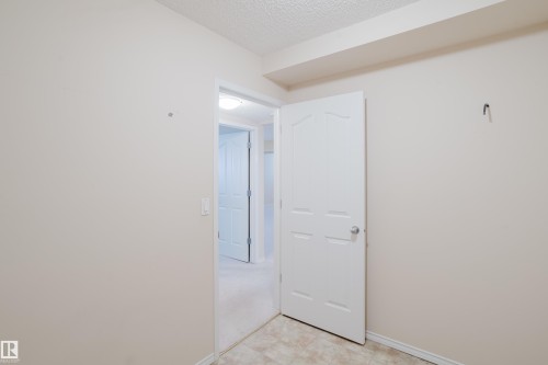 A space that could be dedicated to storage - 9 102 Bridgeport Crossing, Leduc, AB - Indoor Photo Showing Other Room