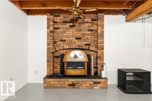 35 Oatway Drive, Stony Plain, AB - Indoor Photo Showing Living Room With Fireplace