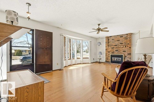 35 Oatway Drive, Stony Plain, AB - Indoor Photo Showing Living Room With Fireplace