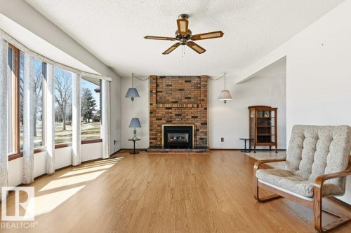35 Oatway Drive, Stony Plain, AB - Indoor Photo Showing Living Room With Fireplace